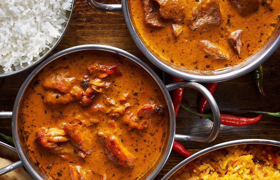 Homemade butter chicken with rice and naan