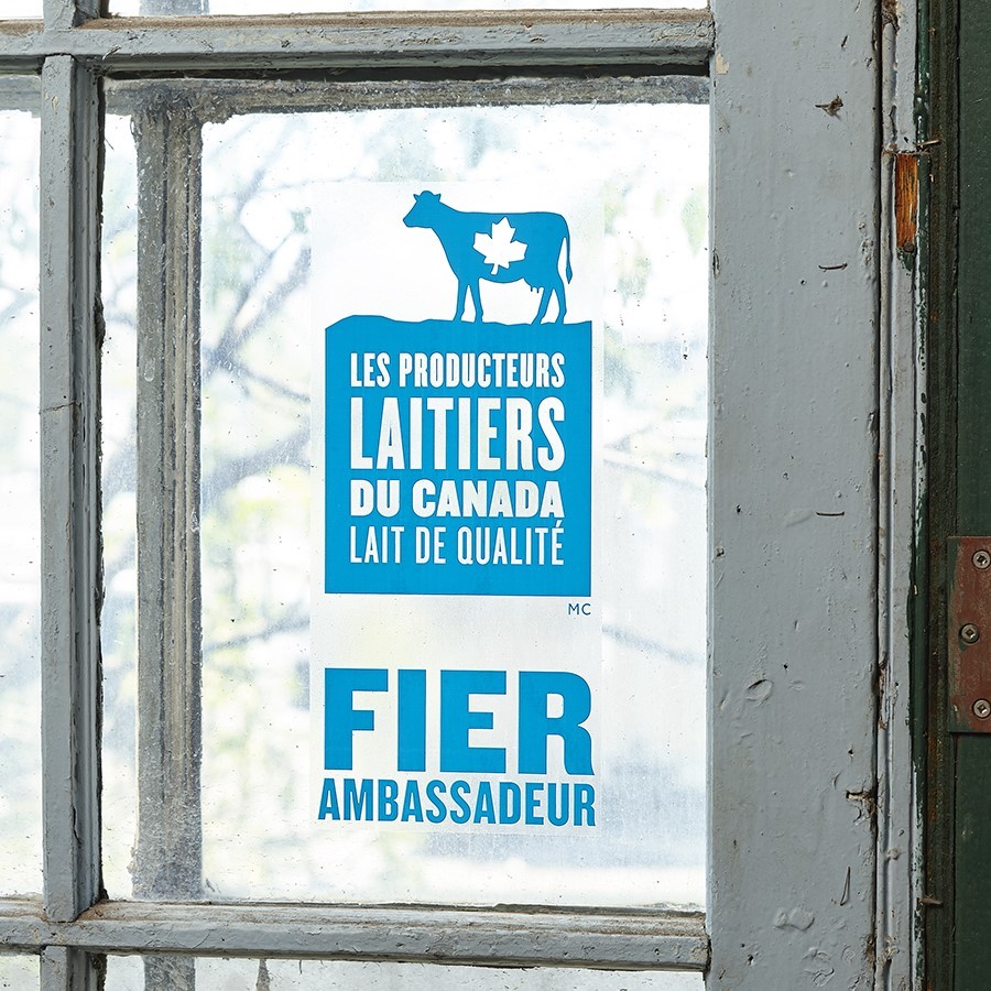 Fier Ambassadeur window cling in French on a window